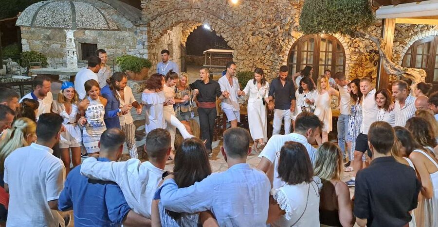Chania: Cretan Folklore Dance Show with Dinner - Dinner at the village-style venue