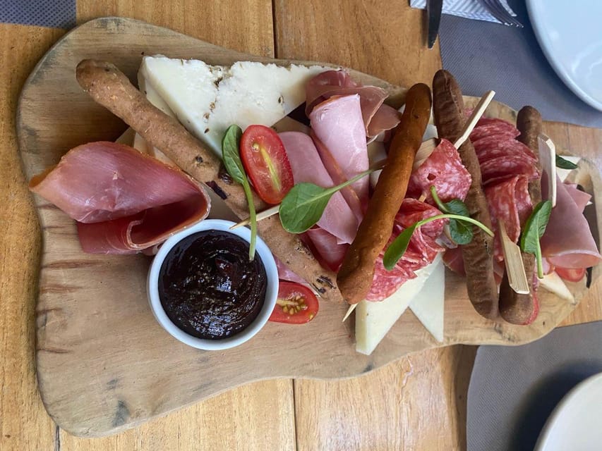 Chania Walking Food And Wine Night Tour - Cretan cheese, wine, and the harbor view