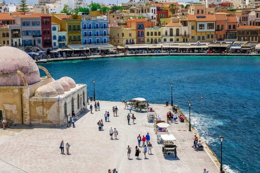 Chania Walking Food And Wine Night Tour - Kalitsounia and sfakianopita in a cozy restaurant