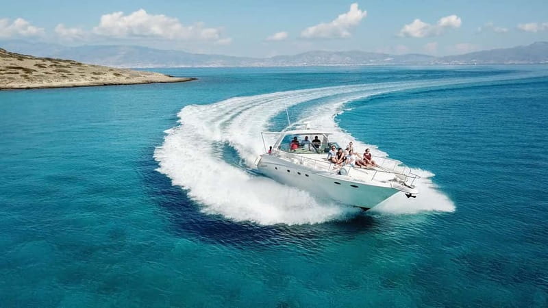 Crete: Chrissi Island Yacht Cruise with Lunch & Snorkeling - Returning to the yacht for clear-water swimming