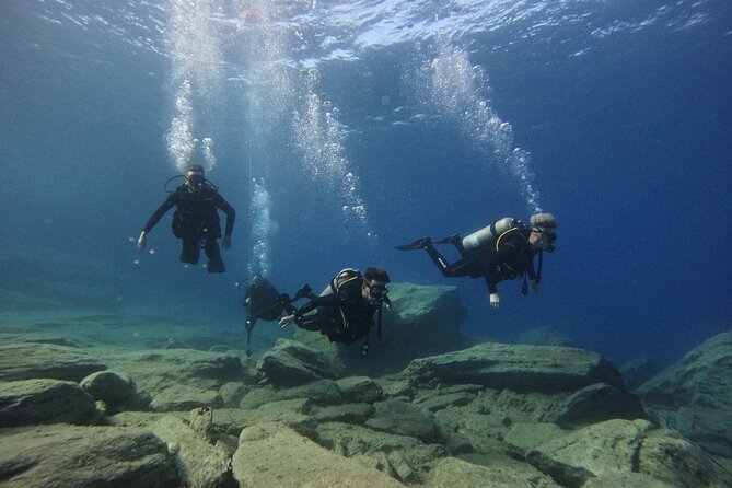 Experience Scuba Diving in Heraklion Crete - Entering from the beach at Mononaftis