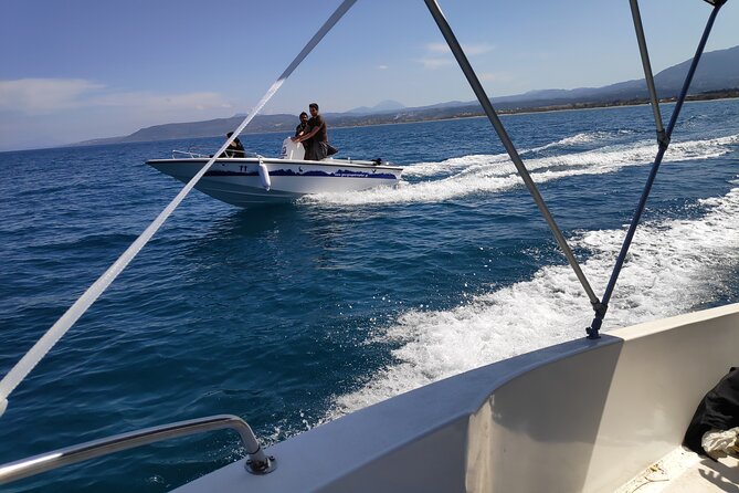 Half-Day Small-Group Boat Safari in Crete - Taking the wheel near Omprogialos