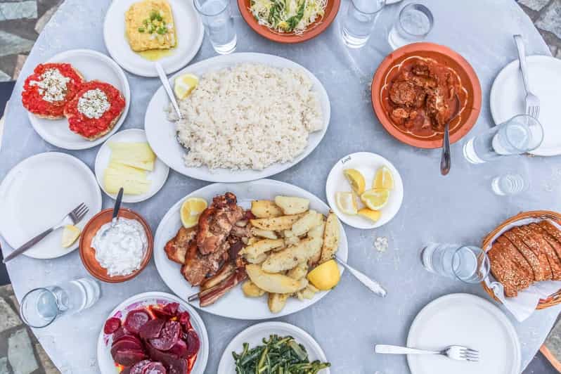Heraklion City: Greek Food Tasting Walking Tour - Dakos, moussaka, and kalitsounia at the taverna
