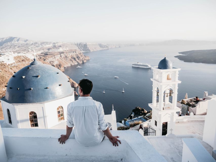 Heraklion: Santorini Day Trip with Boat Transfer & Oia Visit - Arriving below Santorini’s cliffs