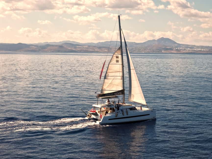 Hersonissos: Sunset Catamaran Cruise with Snacks and Drinks - Sailing out of Hersonissos in the late afternoon