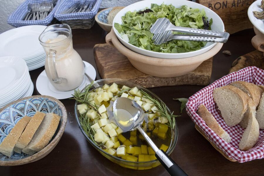 Kissamos: Greek Night with Buffet Dinner and Plate Smashing - Dining at the 15.3-meter Greek table