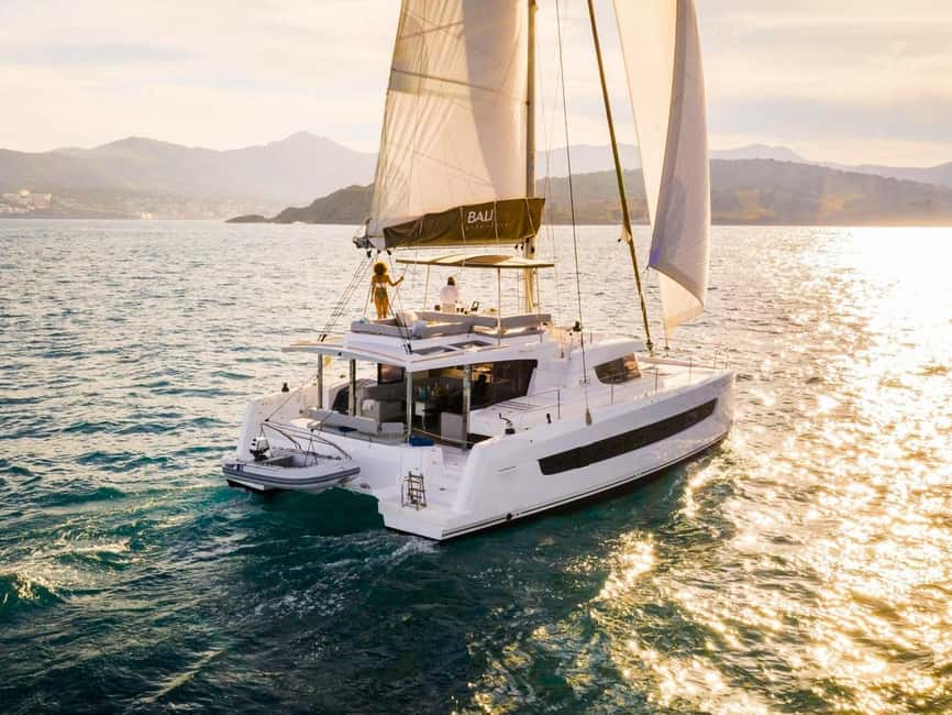 Panormo: Sunset All-Inclusive Catamaran Cruise with Snacks - Setting sail from Panormo in the evening