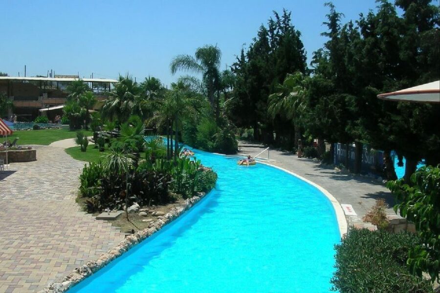 Rethymno Area: Limnoupolis Water Park Ticket with Transfers - The pool bar, sunbeds, and White Mountain views