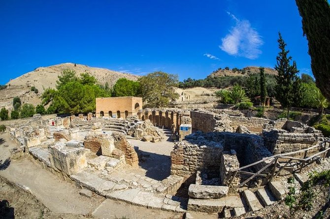 South Crete: Matala Beach & Ancient Gortyn - Matala Beach and the cave-filled cliffs